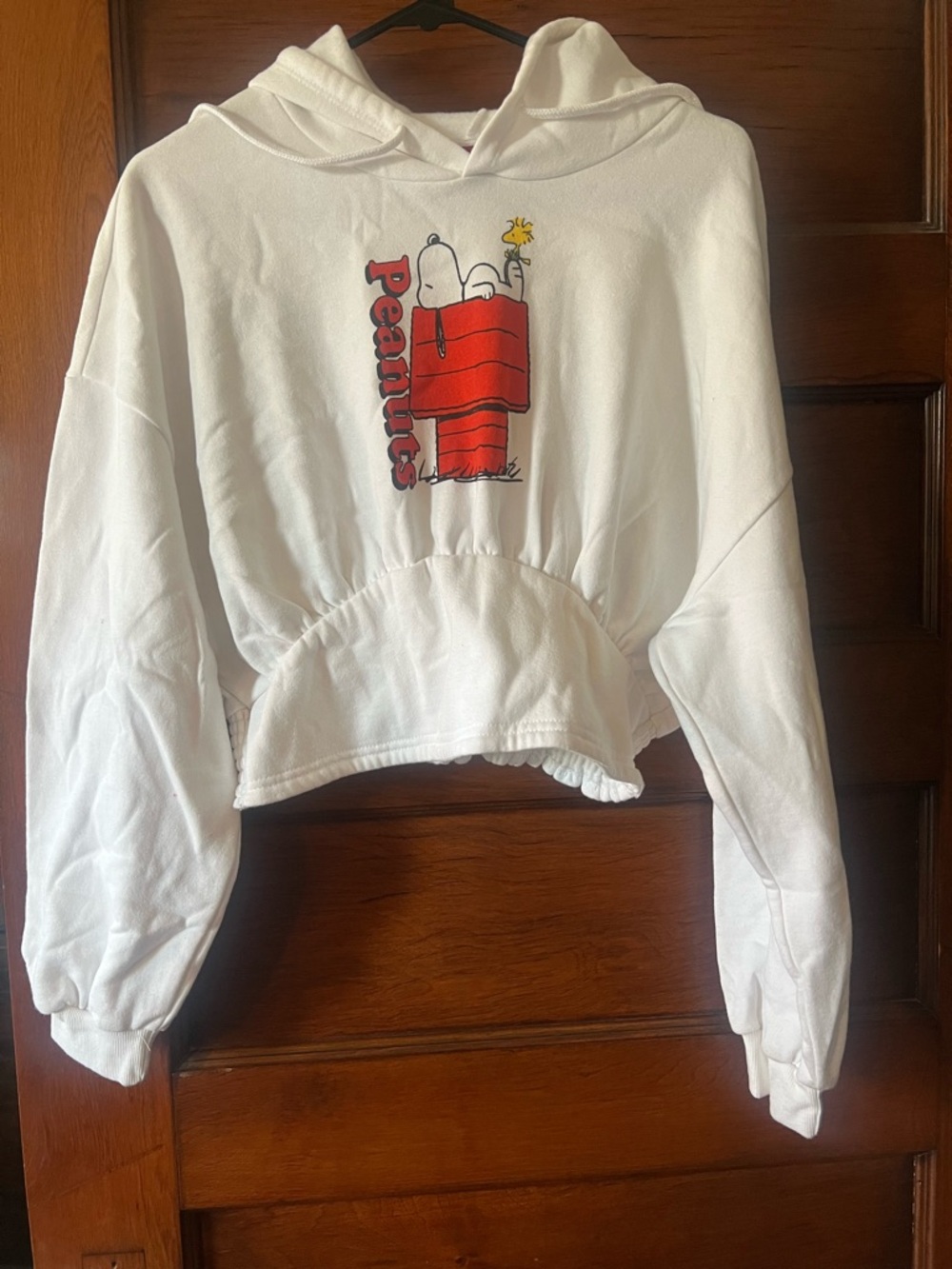 Peanuts White Cropped Hoodie with Red Snoopy Doghouse Graphic